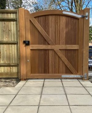 Paving and wooden door to link a garden space.